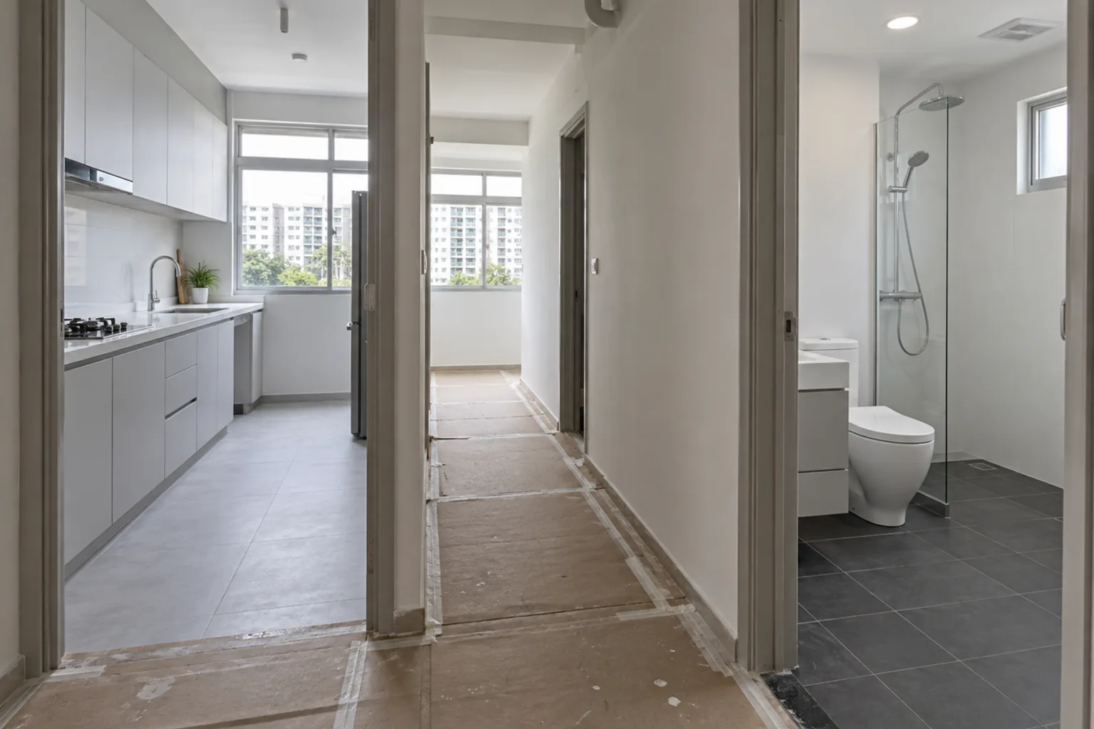 Illustrative flat under renovation with a finished kitchen on one side and a finished bathroom on the other